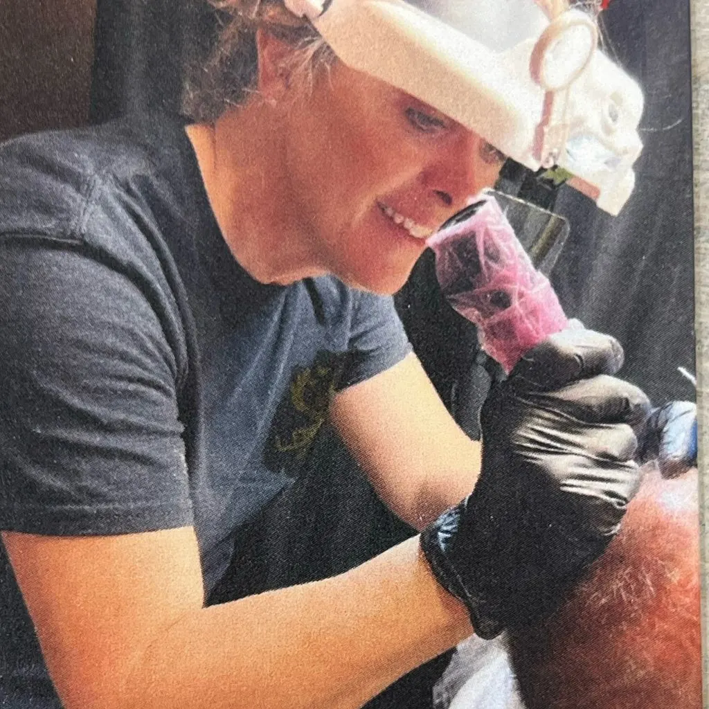 Tracy working with a pigment machine under magnification